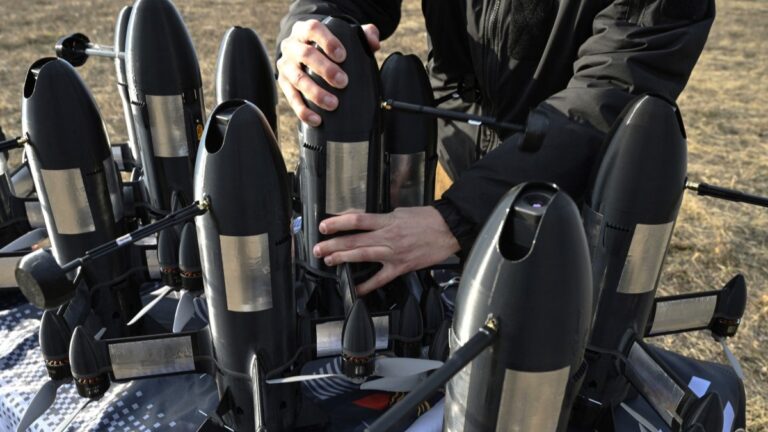 An employee of the Ukrainian SkyFall company checks a P1-Sun interceptor drone before a test flight at an undisclosed location in Ukraine on March 19, 2026.