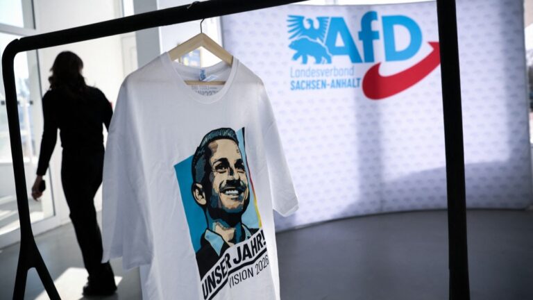 AfD merchandise, including a shirt with the portrait of the party's top candidate for regional elections in Saxony-Anhalt, is on display in the Hyparschale hall in Magdeburg, eastern Germany, during a regional party congress on April 11, 2026.