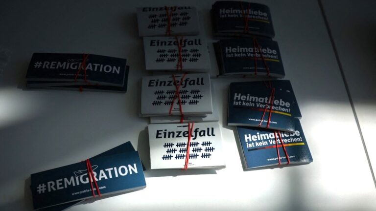 Afd merchandise, including stickers reading "Remigration", is on display in the Hyparschale hall in Magdeburg, eastern Germany, during a regional party congress on April 11, 2026.
