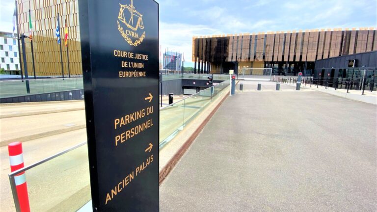 A sign points visitors in the direction of the Ancien Palais building of the CJEU's Palais de la Cour de Justice.