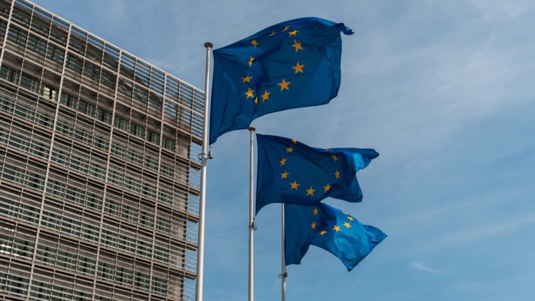 EU flags outside the Belaymont building in Brussels (Unsplash)