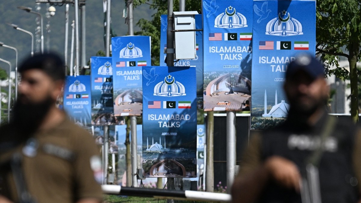 Security personnel stand guard at a security checkpost along a road temporarily closed near the Serena Hotel at the Red Zone area in Islamabad on April 20, 2026, ahead of anticipated U.S.-Iran peace talks.