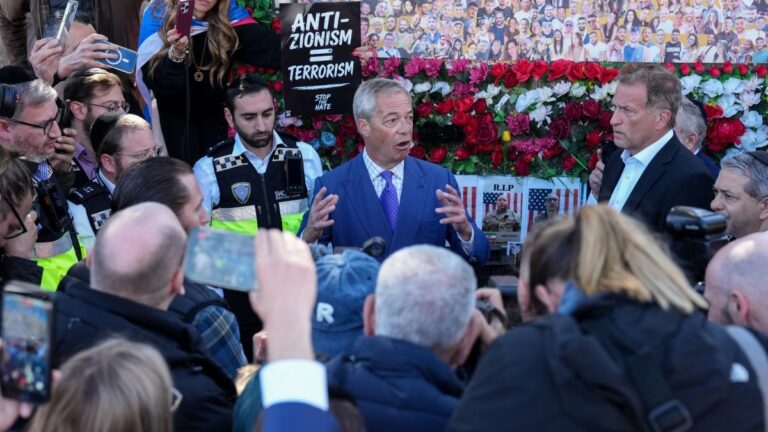 Reform UK party leader Nigel Farage (C) speaks as he visits the area where two men were stabbed the day before, in the Golders Green neighbourhood of north London, on April 30, 2026.