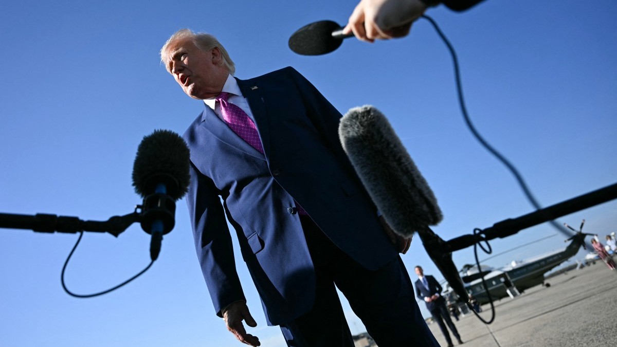 U.S. President Donald Trump speaks to journalists before boarding Air Force One at Joint Base Andrews, Maryland on April 10, 2026.