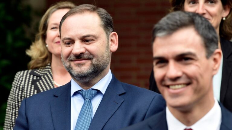 Spanish minister for development José Luis Ábalos (L) smiles as he poses with Spanish Prime Minister Pedro Sánchez and the rest of new ministers for a family photo following their first cabinet meeting in Madrid on June 8, 2018.