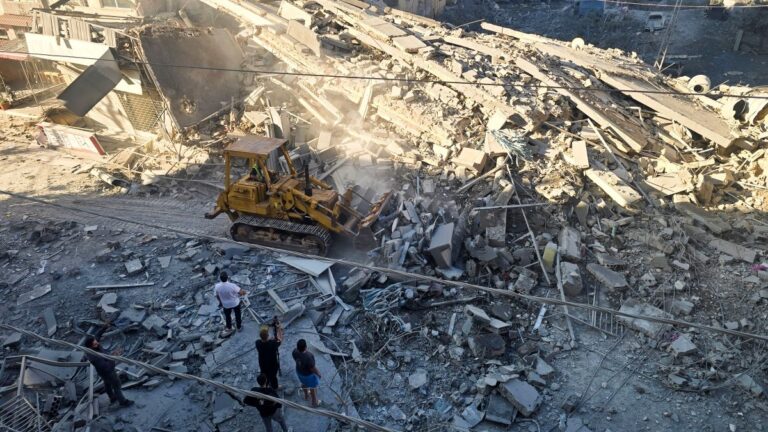 A municipal worker uses a bulldozer to clear debris from a street at the site of an Israeli strike in Tyre, southern Lebanon, on May 28, 2026.