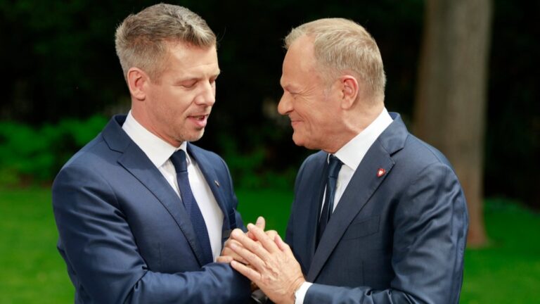 Hungary’s Prime Minister Péter Magyar (L) and Poland’s Prime Minister Donald Tusk shake hands at the end of a joint press conference at the garden of the Polish Prime Minister's residency in Warsaw, Poland, on May 20, 2026.
