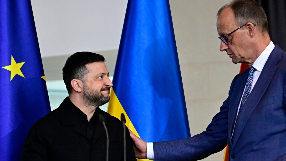 German Chancellor Friedrich Merz (R) and Ukrainian President Volodymyr Zelensky react at the end of a joint press conference at the Chancellery in Berlin on April 14, 2026.