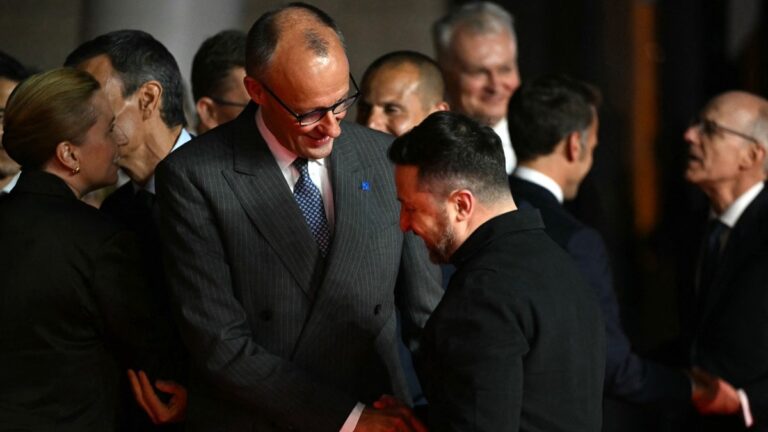Germany’s Chancellor Friedrich Merz (C) shakes hands with Ukraine’s President Volodymyr Zelensky ahead of an informal meeting of the European Council, in Ayia Napa on April 23, 2026.