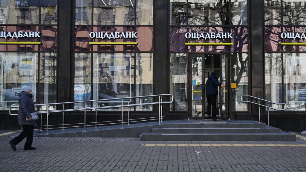 A man enters an office of the State Savings Bank of Ukraine, or Oschadbank, in Kyiv on March 6, 2026.