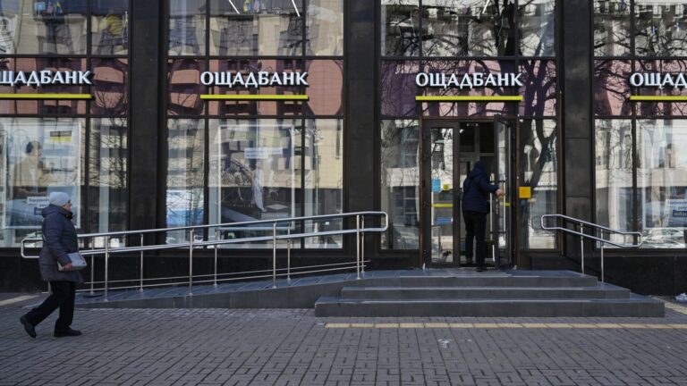 A man enters an office of the State Savings Bank of Ukraine, or Oschadbank, in Kyiv on March 6, 2026.
