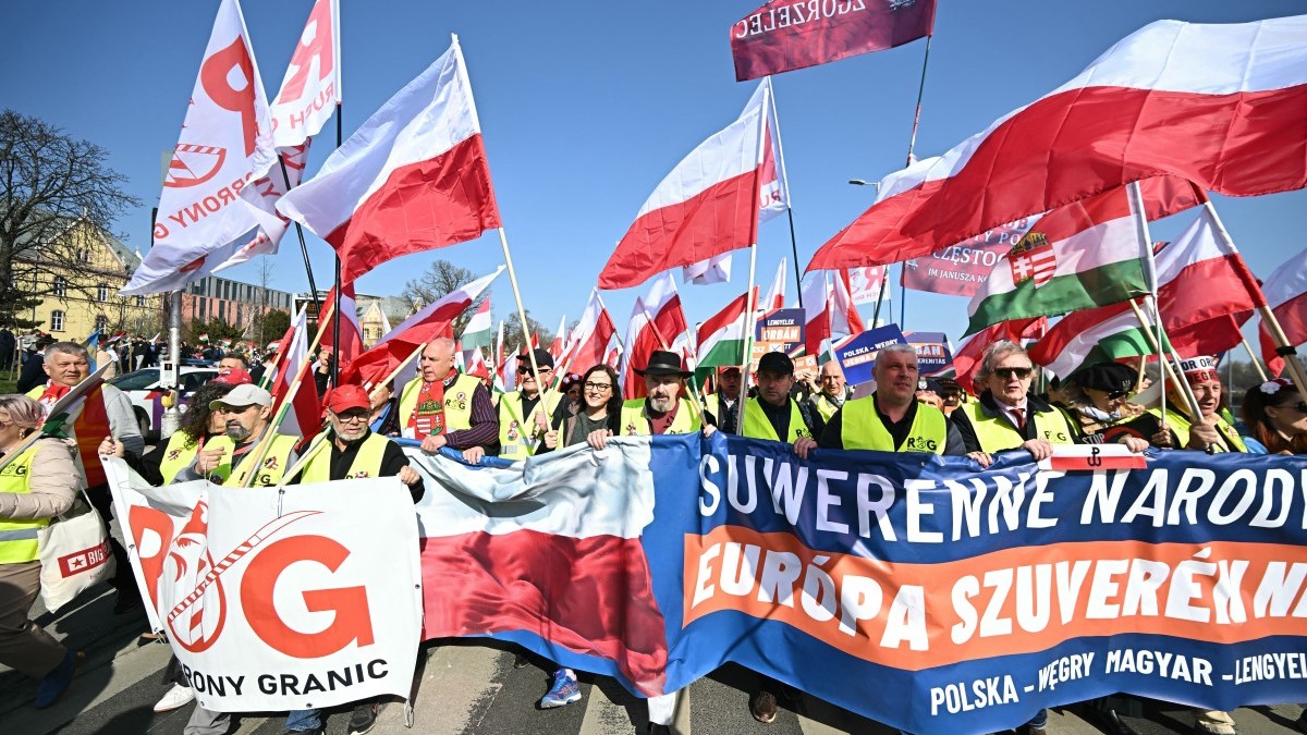 Polish participants wave Polish and Hungarian flags and carry a large banner reading “Europe of sovereign nations” during the Peace March in support of the government of Prime Minister Viktor Orbán on the Margaret Bridge in Budapest, Hungary on March 15, 2026.
