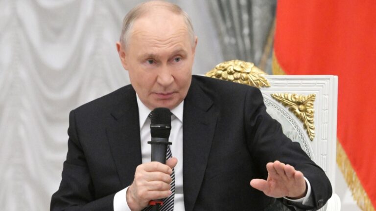 Russia’s President Vladimir Putin meets with graduates of the “Time of Heroes” programme, which aims to integrate veterans of the Russian-Ukrainian conflict into high-ranking public positions, at the Kremlin in Moscow on May 22, 2026.