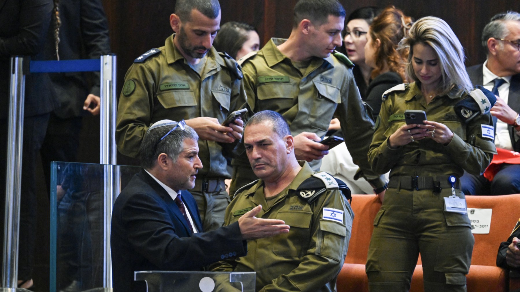 Head of the Shin Bet domestic security agency Maj Gen David Zini (bottom L) speaks with Israel’s army chief, Lieutenant General Eyal Zamir, as they arrive to the Israeli parliament, the Knesset, ahead of an address by the U.S. president in Jerusalem on October 13, 2025.