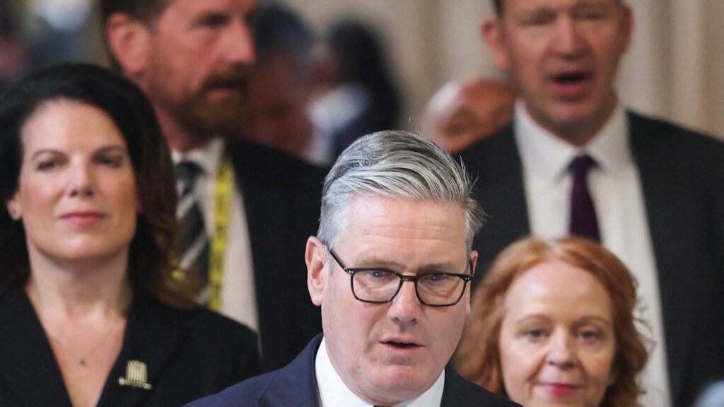 Britain’s Prime Minister Keir Starmer (C) returns to the House of Commons after listening to the king's speech during the State Opening of Parliament at the Palace of Westminster in London on May 13, 2026.
