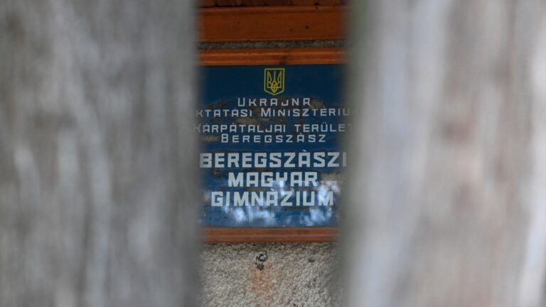 This photograph taken in Berehove (Beregszász) in Transcarpathia, western Ukraine, on March 7, 2022, shows the sign ‘Hungarian high school of Beregszász’.