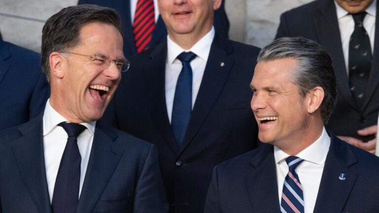 NATO Secretary General Mark Rutte (L) and U.S. Defense Secretary Pete Hegseth react as they pose with Defence Ministers during a family photograph on the sidelines of a NATO Defence Ministers meeting at the NATO headquarters, in Brussels, on June 18, 2026.
