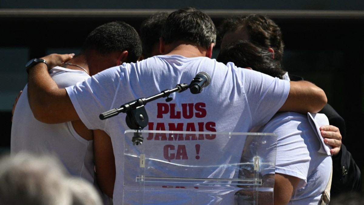 Relatives of the late Lyhanna comfort each other during a silent march in tribute to the 11-year-old girl found dead on June 4, in Fleurance, France on June 7, 2026.