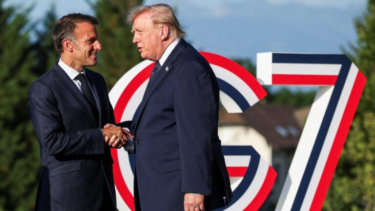 France’s President Emmanuel Macron (L) greets U.S. President Donald Trump during the G7 summit, in Evian, eastern France, on June 15, 2026.