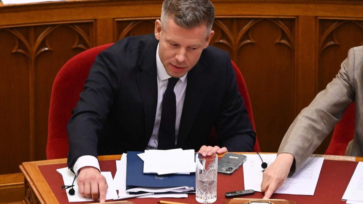 Hungarian Prime Minister Péter Magyar (L) and Foreign Minister Anita Orbán (R not pictured) vote with other members of parliament in the main hall of the Parliament on June 23, 2026, during an extraordinary session of the National Assembly.