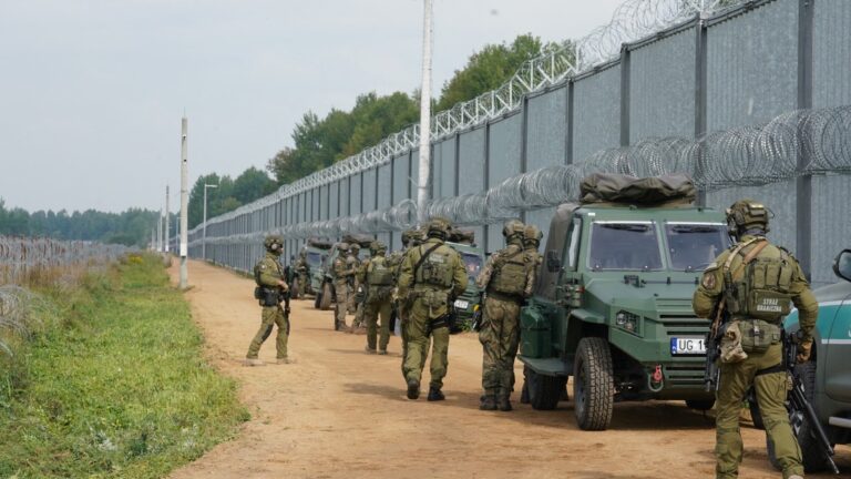 Polish border guards secure the area before Polish Prime Minister Donald Tusk and President of European Commission Ursula von der Leyen visit the fence at the Poland/Belarus border on August 25, 2025 in Krynki, eastern Poland.