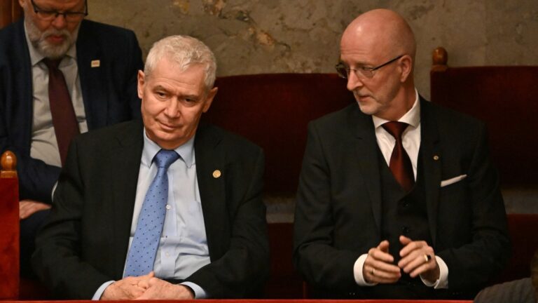 President of the Constitutional Court Péter Polt (L) and Chief Justice András Varga (R) look on as Hungary’s incoming ministers prepare for their oath in the Hungarian Parliament in Budapest, on May 12, 2026.