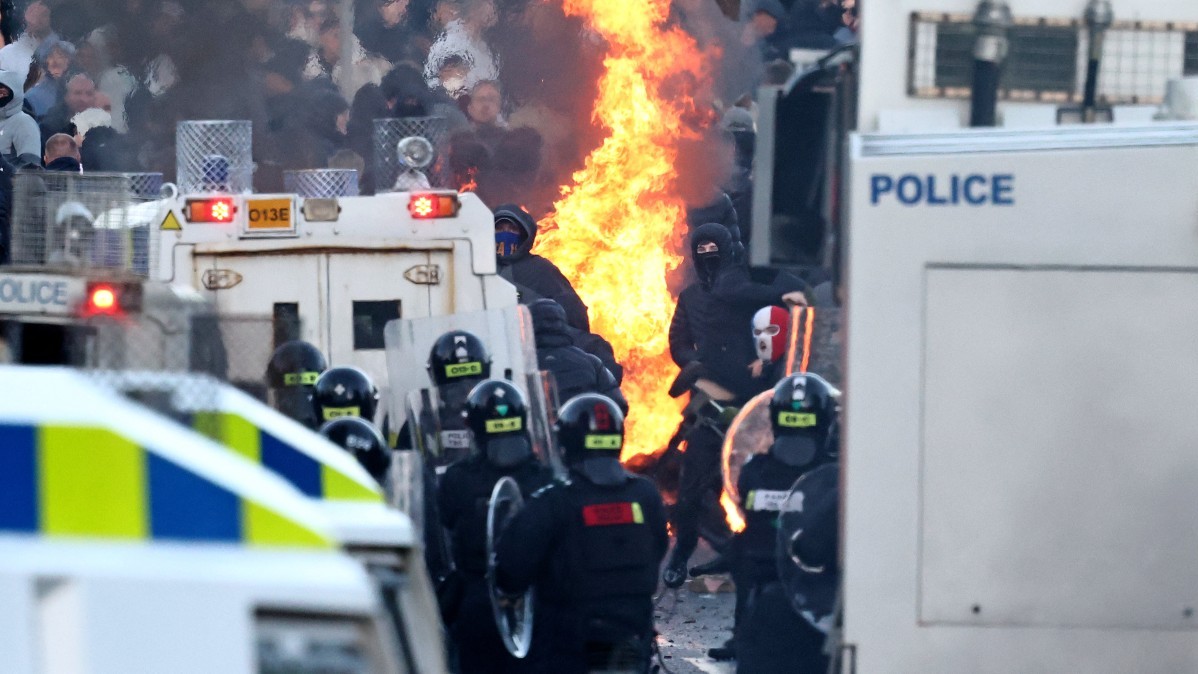 Protesters clash with police blocking their way to a hotel previously believed to house migrants, in Glengormley, north of Belfast, Northern Ireland, on June 10, 2026.
