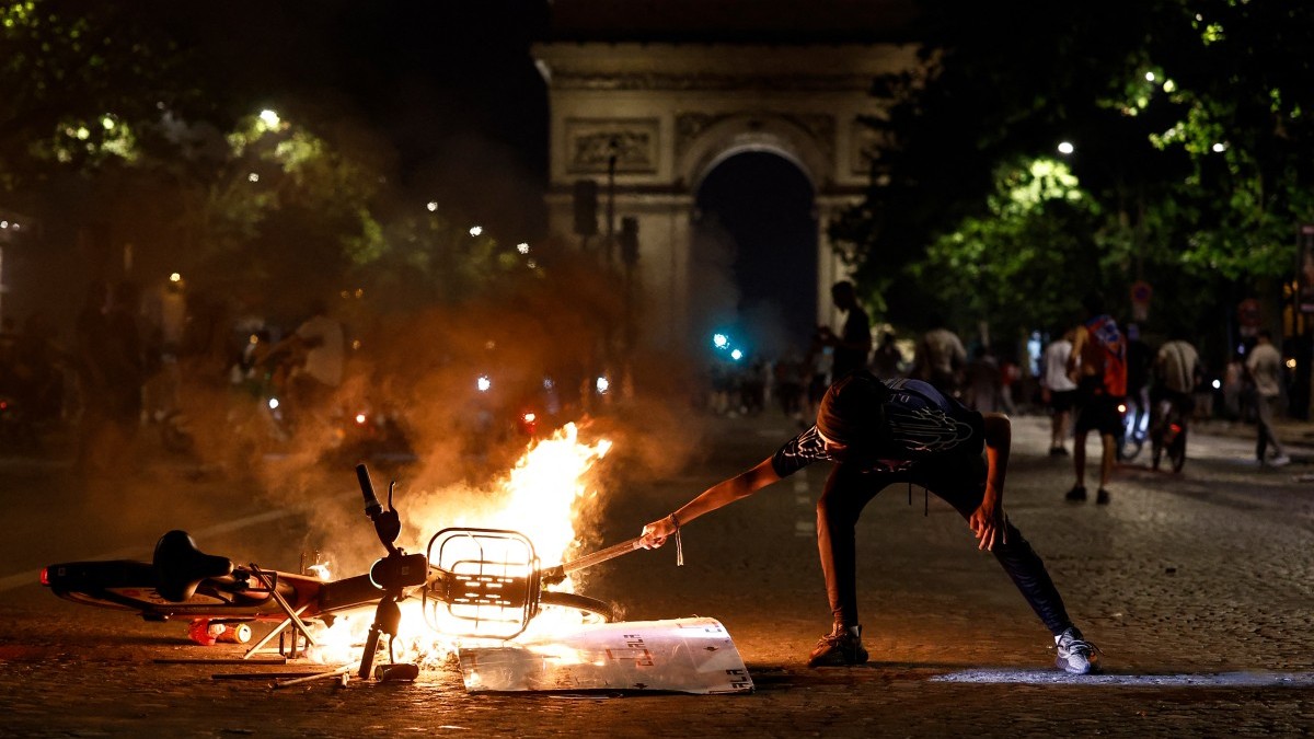 A rioting PSG fan seen with a burning bycicle in Paris after PSG won the UEFA Champions League final in Budapest, on May 30, 2026.
