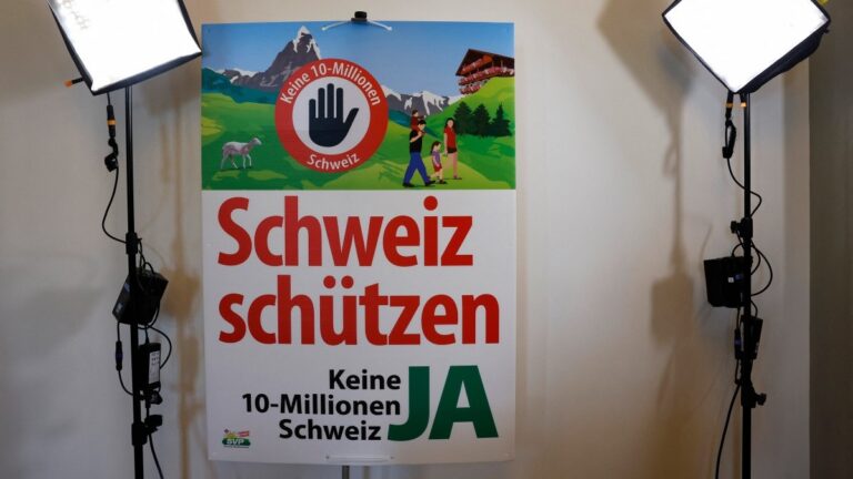 An election placard reading “Protect Switzerland, Not a 10-million Switzerland” as the Swiss vote on a divisive anti-immigration proposal to cap the country’s population and another referendum on restricting access to conscientious objection to military service, in Aarberg on June 14, 2026.