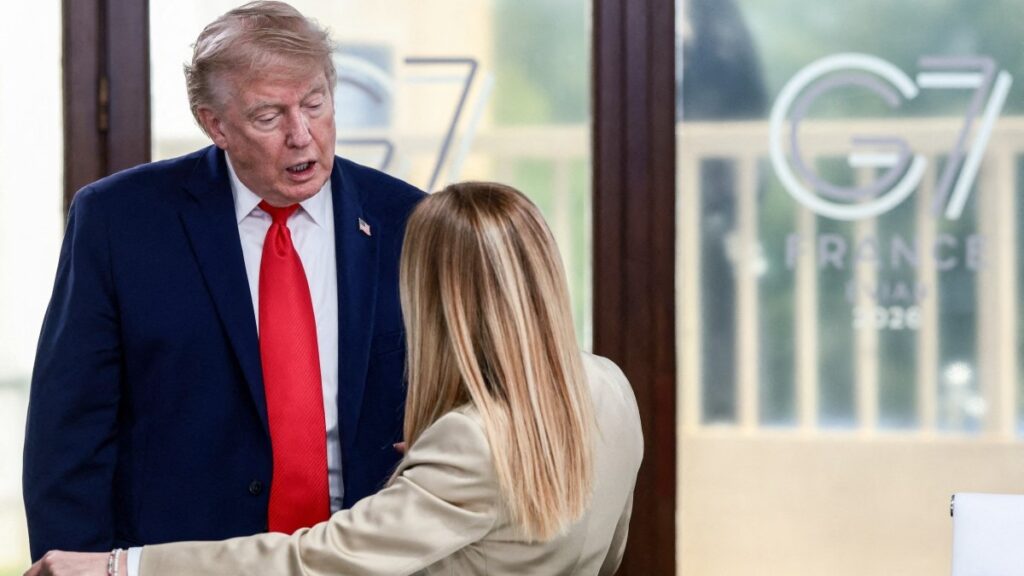 U.S. President Donald Trump speaks with Italy’s Prime Minister Giorgia Meloni during a work lunch as part of the G7 summit, in Evian, eastern France, on June 16, 2026.