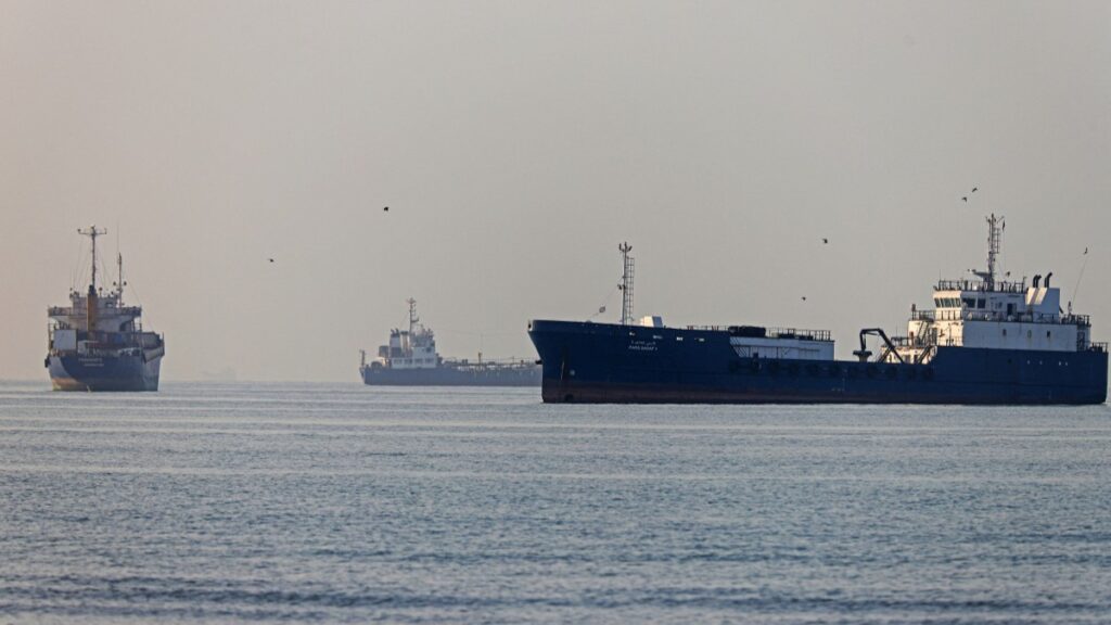On June 1, 2026, vessels sail at Suru Beach in Bandar Abbas along the Strait of Hormuz.