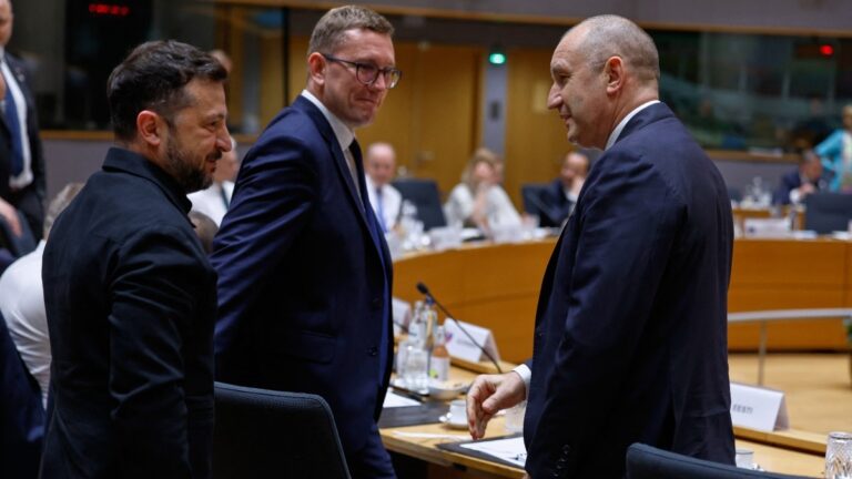 Ukraine’s President Volodymyr Zelensky speaks with Bulgaria’s Prime Minister Rumen Radev (R) as they attend a round table meeting of EU leaders and Ukraine during the EU Summit at the EU headquarters in Brussels, on June 18, 2026.