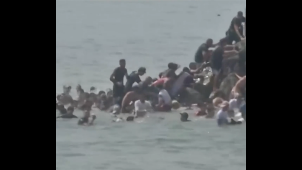 Videos Show Thousands Swimming Into Spain as Border Is Overrun