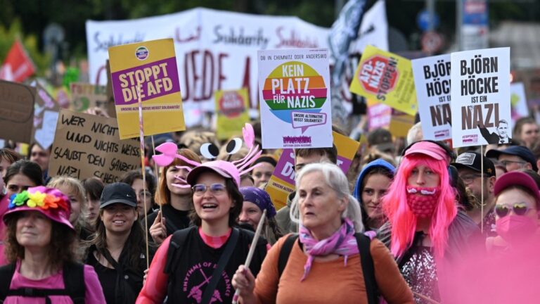 Demonstrators march with placards with the letterings reading (LtoR) ‘Stop AfD’ and ‘No space for Nazis’ and ‘Björn Höcke is a Nazi’ towards the Messe Erfurt fairground in Erfurt, eastern Germany on early July 4, 2026, where the AfD congress was to be held.