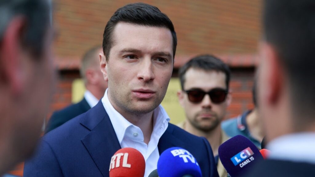 Rassemblement National (RN) leader, MEP and president of the Patriots for Europe (PfE) group Jordan Bardella speks to journalists in front of the border guard office in Białystok, eastern Poland on June 19, 2026.