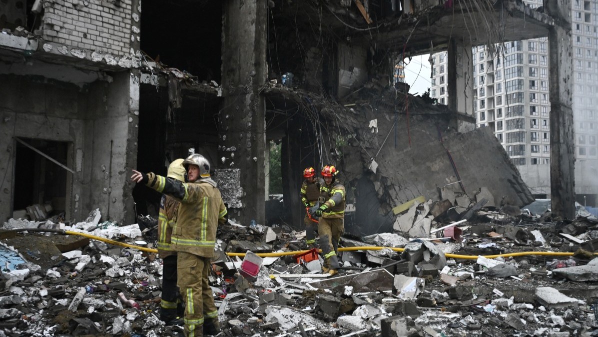 Rescuers work on a multistorey residential building, damaged following a Russian missile strike on the Ukrainian capital of Kyiv, on July 6, 2026.