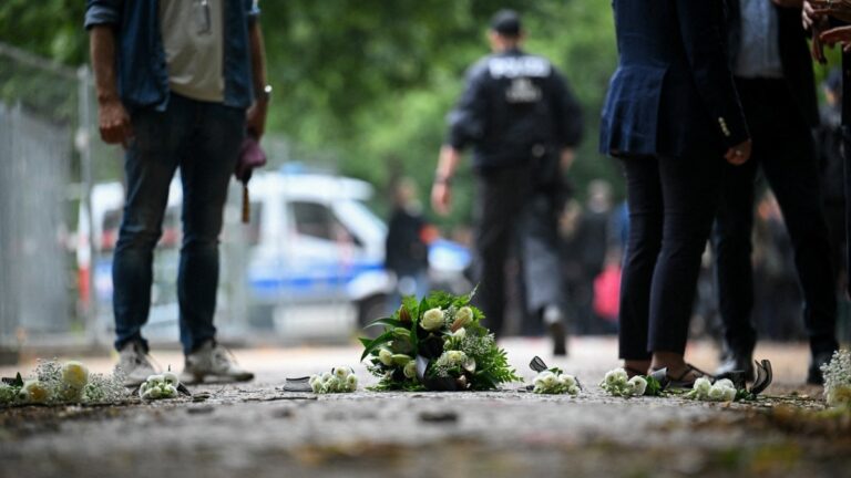 Floral tributes left by German Chancellor Friedrich Merz and members of his government on July 26, 2026 at the site where a Muslim terrorist rammed his car into a crowd near Berlin’s annual Christopher Street Day Pride parade on the evening of June 25th.