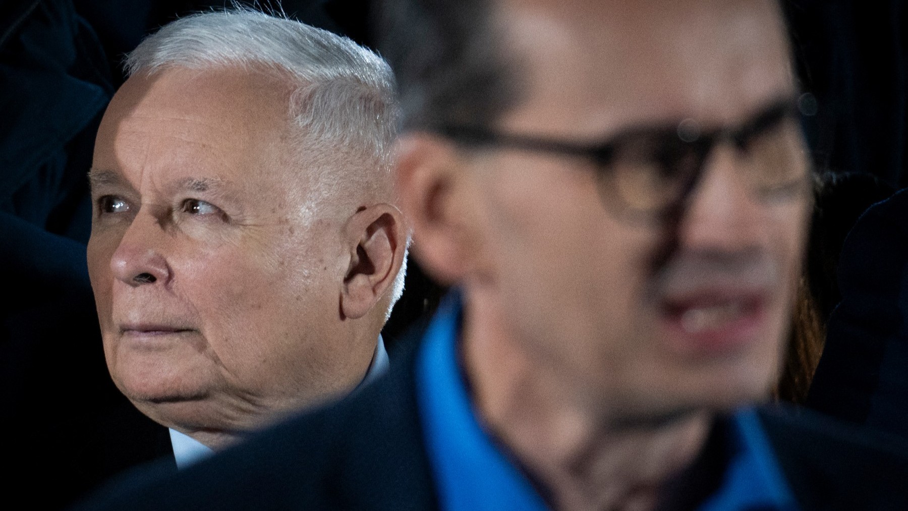Polish Prime Minister Mateusz Morawiecki (R) of the Law and Justice party (PiS) (blurred int he foreground) speaks to supporters with Polish Deputy Prime Minister and PiS leader Jarosław Kaczyński behind him during a rally in Sandomierz, Poland on October 13, 2023.
