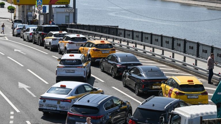 People queue to refuel their cars at a Rosneft gas station in Moscow on July 3, 2026.