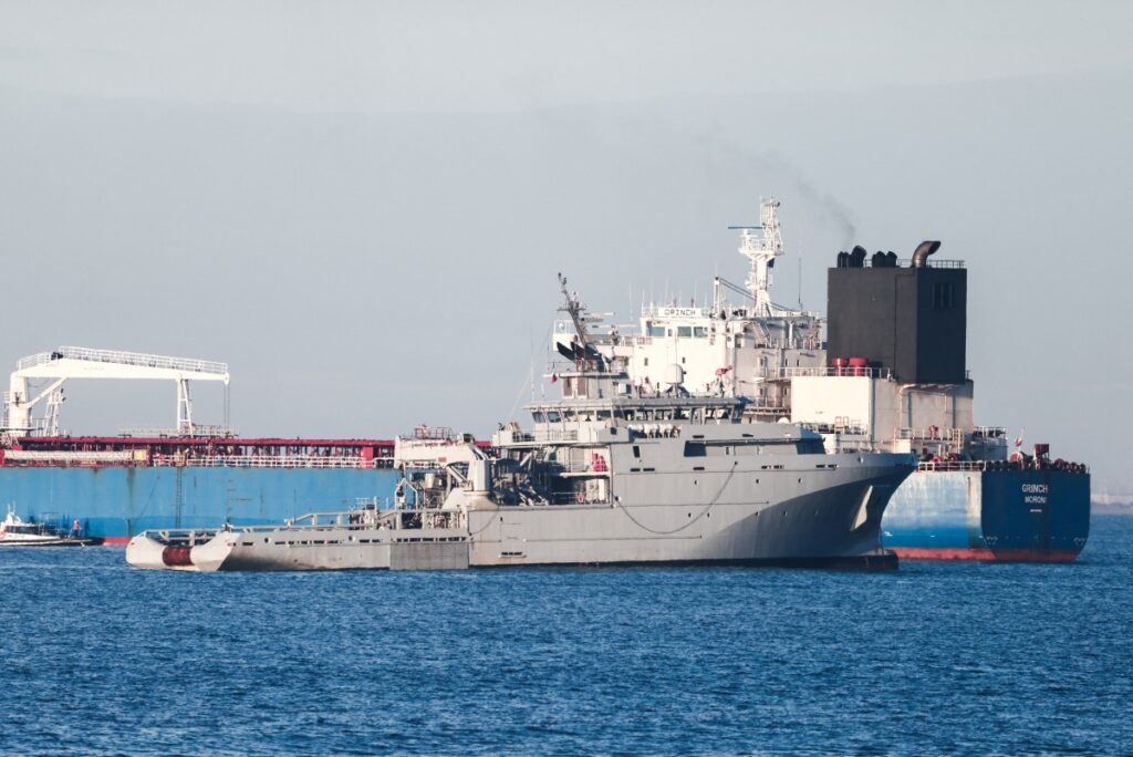 The oil tanker Grinch (R), suspected of belonging to Russia’s shadow fleet, is seen outside the coast of Martigues near the port of Marseille-Fos on January 25, 2026, as it’s surveilled by the French Navy.