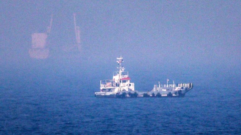 Ships sailing near the Strait of Hormuz off the eastern coast of the United Arab Emirates at Khor Fakkan on July 13, 2026.
