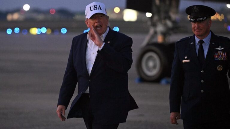 U.S. President Donald Trump gestures toward reporters after disembarking from Air Force One at Joint Base Andrews, Maryland on July 1, 2026.