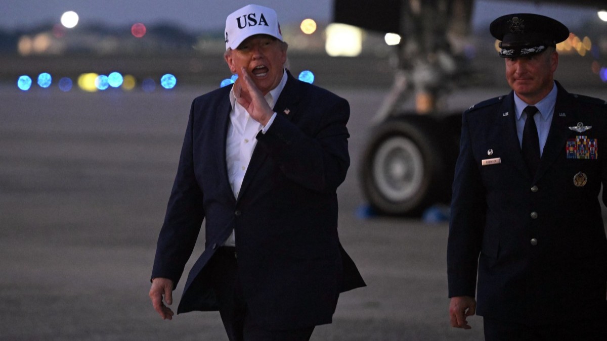 U.S. President Donald Trump gestures toward reporters after disembarking from Air Force One at Joint Base Andrews, Maryland on July 1, 2026.