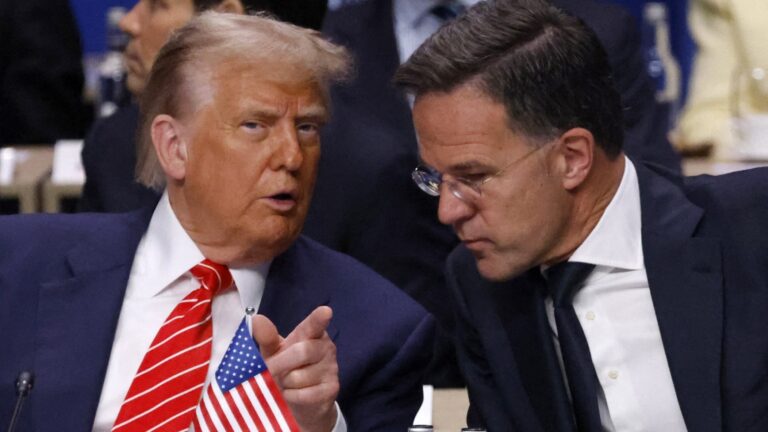 U.S. President Donald Trump (L) speaks with NATO Secretary General Mark Rutte as they attend the North Atlantic Council plenary meeting at the NATO summit in The Hague on June 25, 2025.