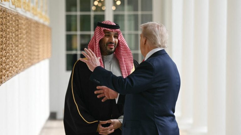 U.S. President Donald Trump and Crown Prince and Prime Minister of the Kingdom of Saudi Arabia Mohammed bin Salman converse as they walk down the Colonnade on the way to the Oval Office of the White House in Washington, D.C., on November 18, 2025.