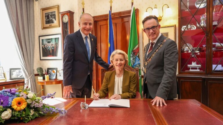 European Commission President Ursula von der Leyen (C) poses with Ireland’s Prime Minister Micheal Martin (L) and Cork Mayor Damian Boylan, in the Mayors parlour, ahead of meetings between the Irish government and the European Commission's College of Commissioners, at University College Cork (UCC) in Cork, Ireland on July 2, 2026, a day after Ireland took on the rotating EU presidency.