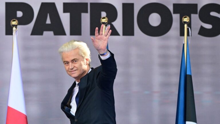Leader of the Netherlands' Party for Freedom (PVV) Geert Wilders waves on stage at Piazza Duomo during a rally organized by the Patriots for Europe group (PfE) in Milan on April 18, 2026.