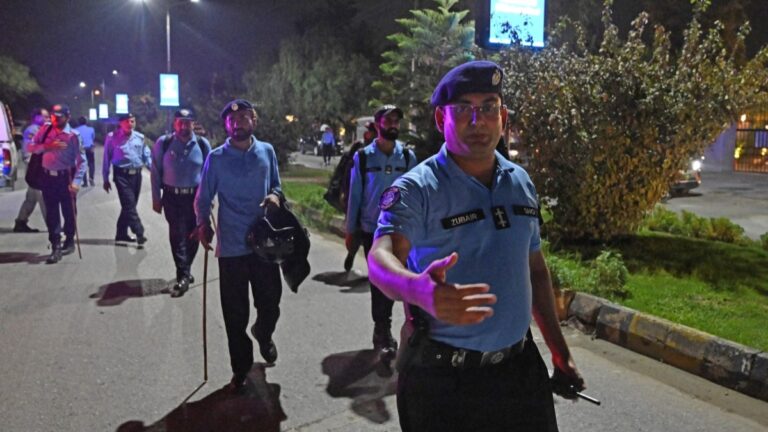 Security personnel clear the road as they cordon off a street outside the Shifa International Hospital in Islamabad on August 20, 2026, after Pakistan’s Supreme Court ordered to transfer jailed former prime minister Imran Khan to hospital for medical treatment.