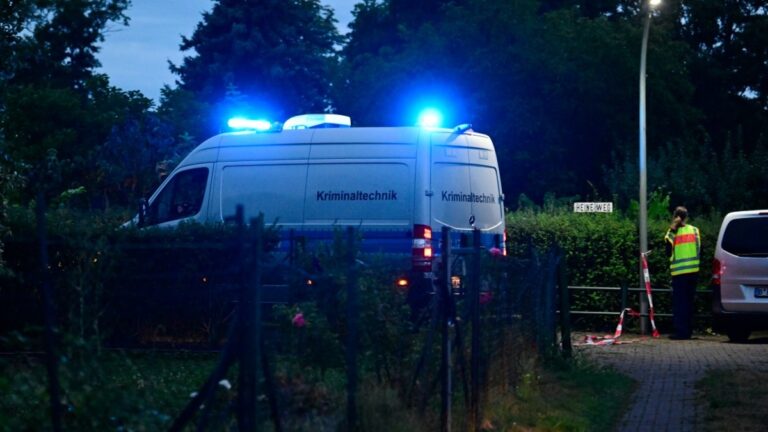 A forensic science police van drives towards the scene in an allotment complex in the western Spandau district of Berlin on July 26, 2026, where the chief suspect in the previous nights’ deadly attack near Berlin’s Pride parade was shot dead.