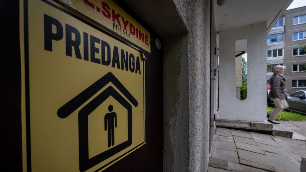 A yellow sticker reading “Priedanga” (Shelter) is seen at the entrance to the basement, which is to serve as a shelter for residents in case of danger in the Fabijoniskes residential area in Vilnius on May 27, 2026.